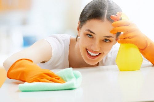 Spot cleaning a rug stain carefully with a cloth