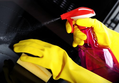 Technician cleaning commercial glass windows
