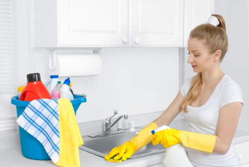 Kitchen surfaces being cleaned during move out cleaning
